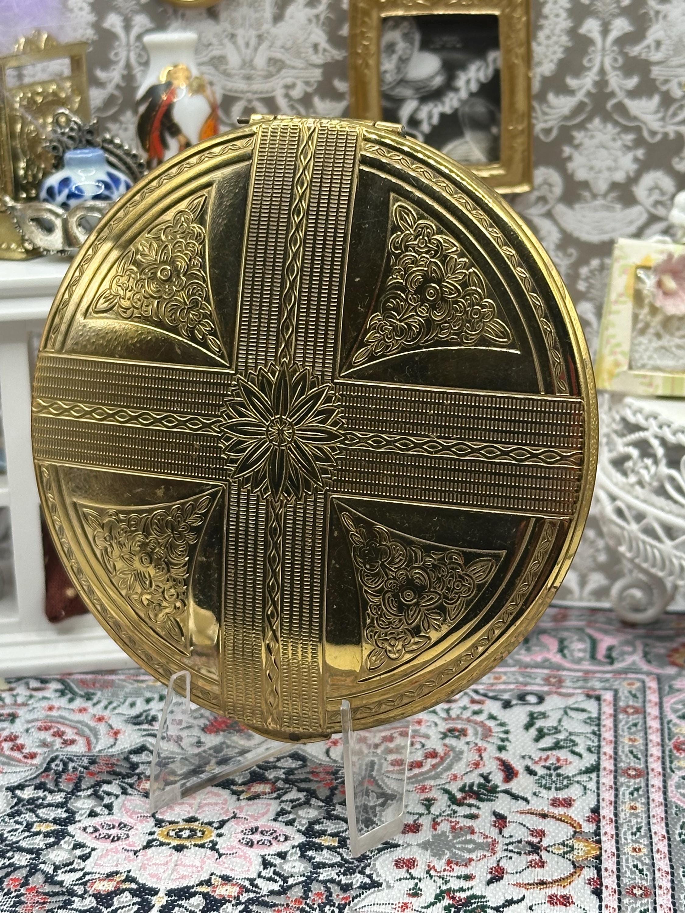 Vintage Kigu Powder Compact – Large Gold‑Tone Floral & Ribbon Design