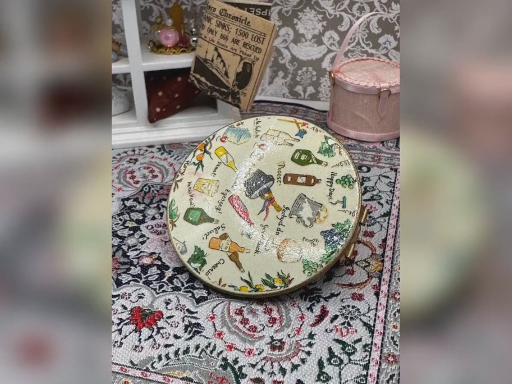 Vintage Stratton Lip View Compact: Multilingual Toasts & Grapes Design